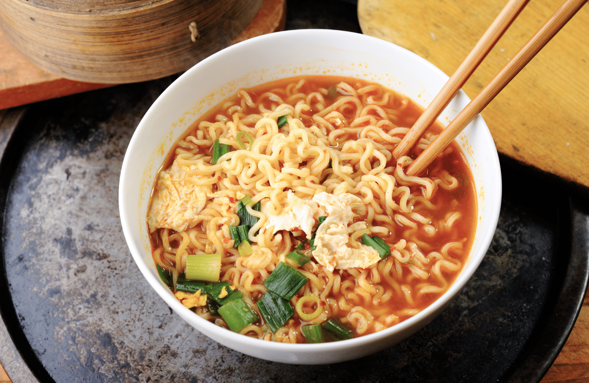 A ramen noodle dish with chopsticks.