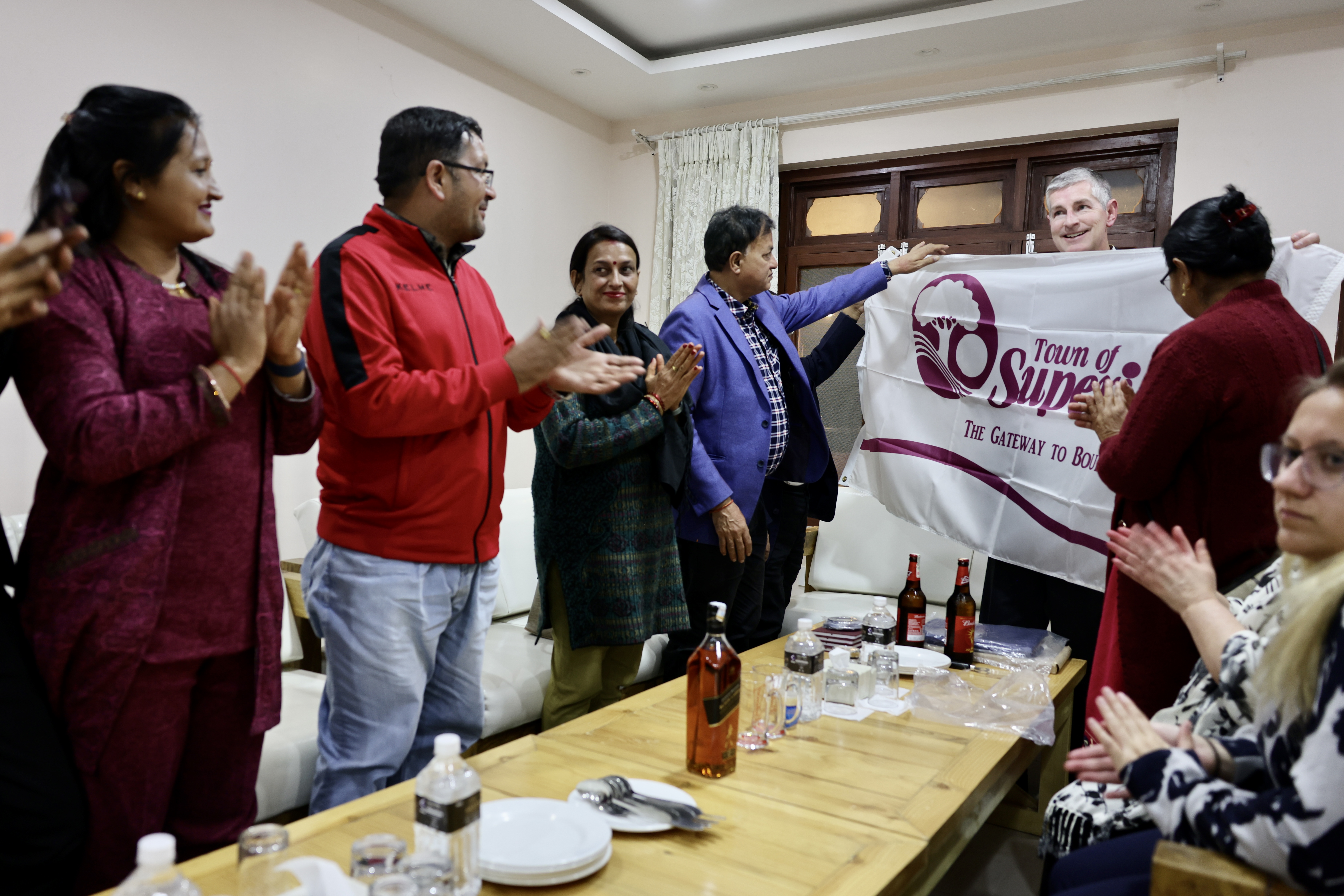 The mayor of a town in Colorado gifting a flag to the mayor of Khandbari, Nepal.