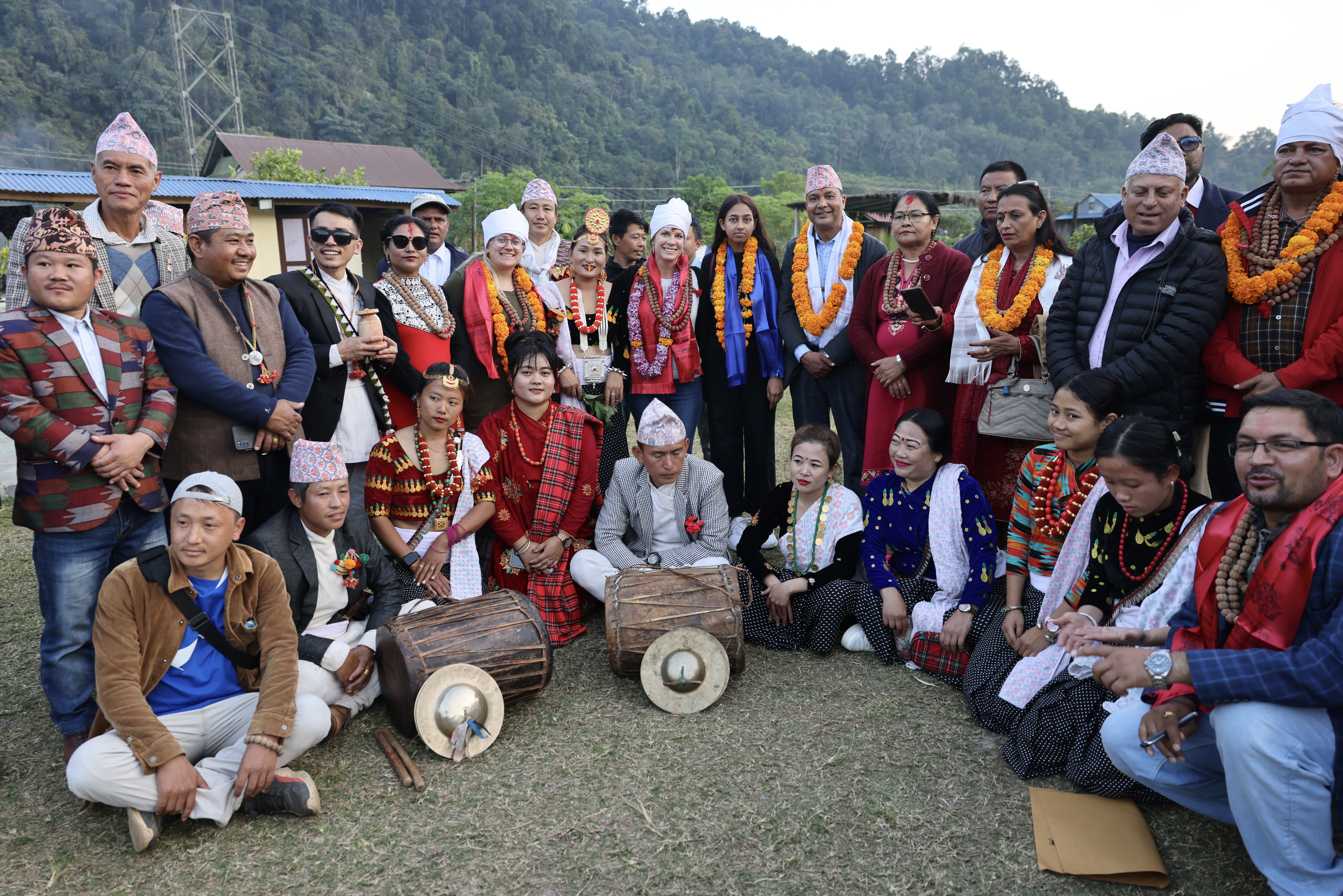 A group of people in traditional Nepali outfits.