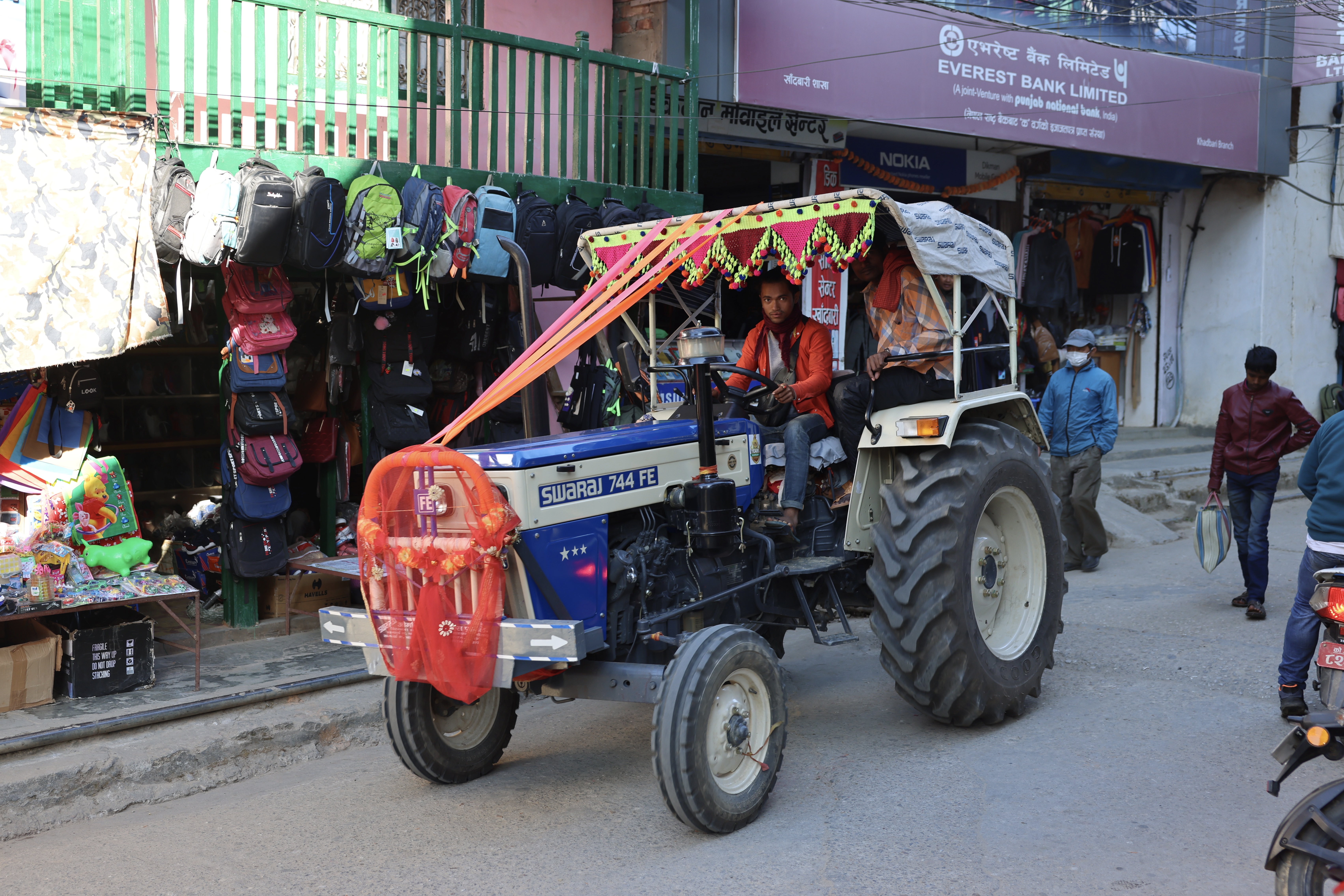 A colorfully decorated farm tractor.