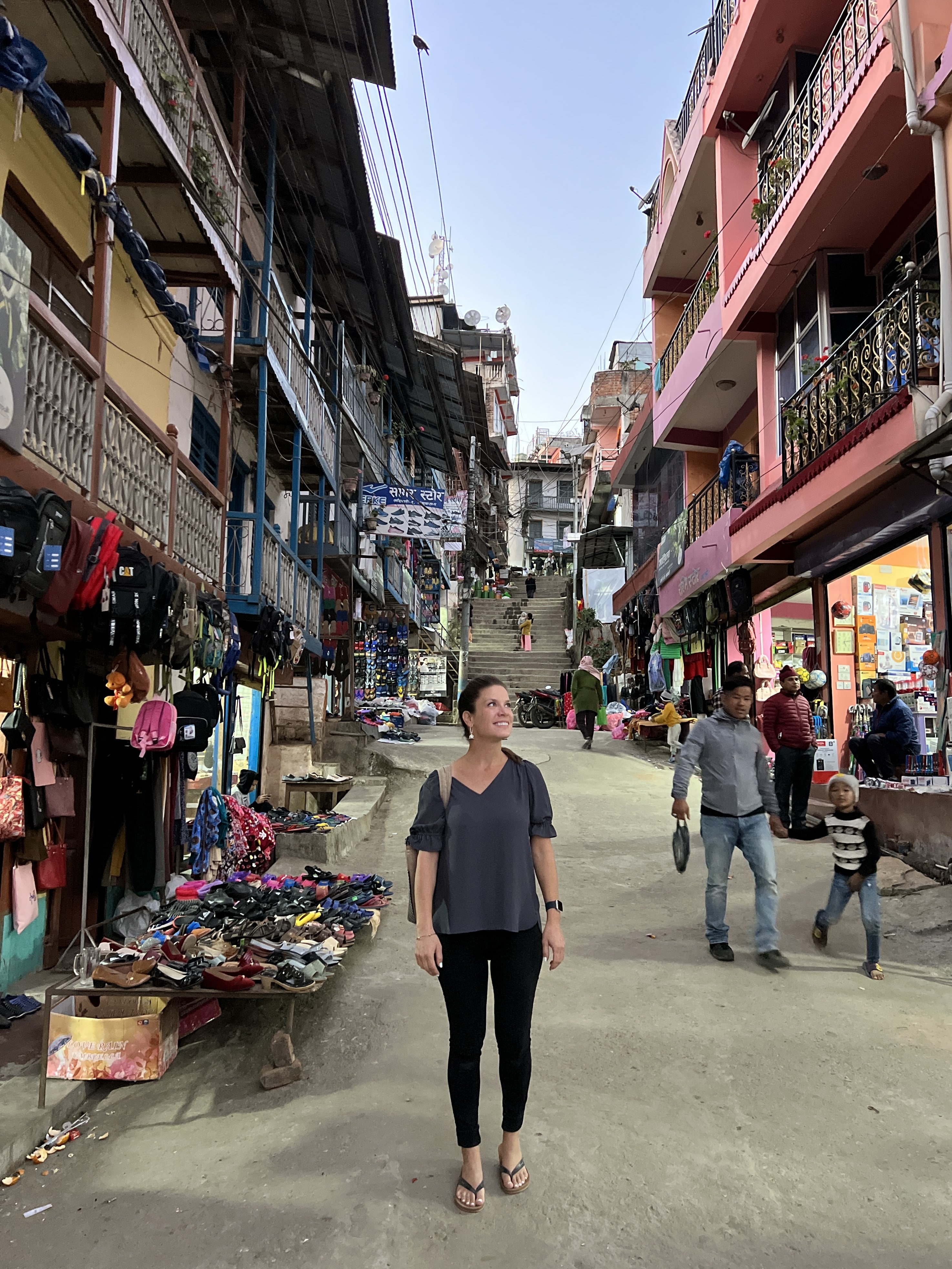 Woman walking the streets of Khandbari, Nepal at dusk.