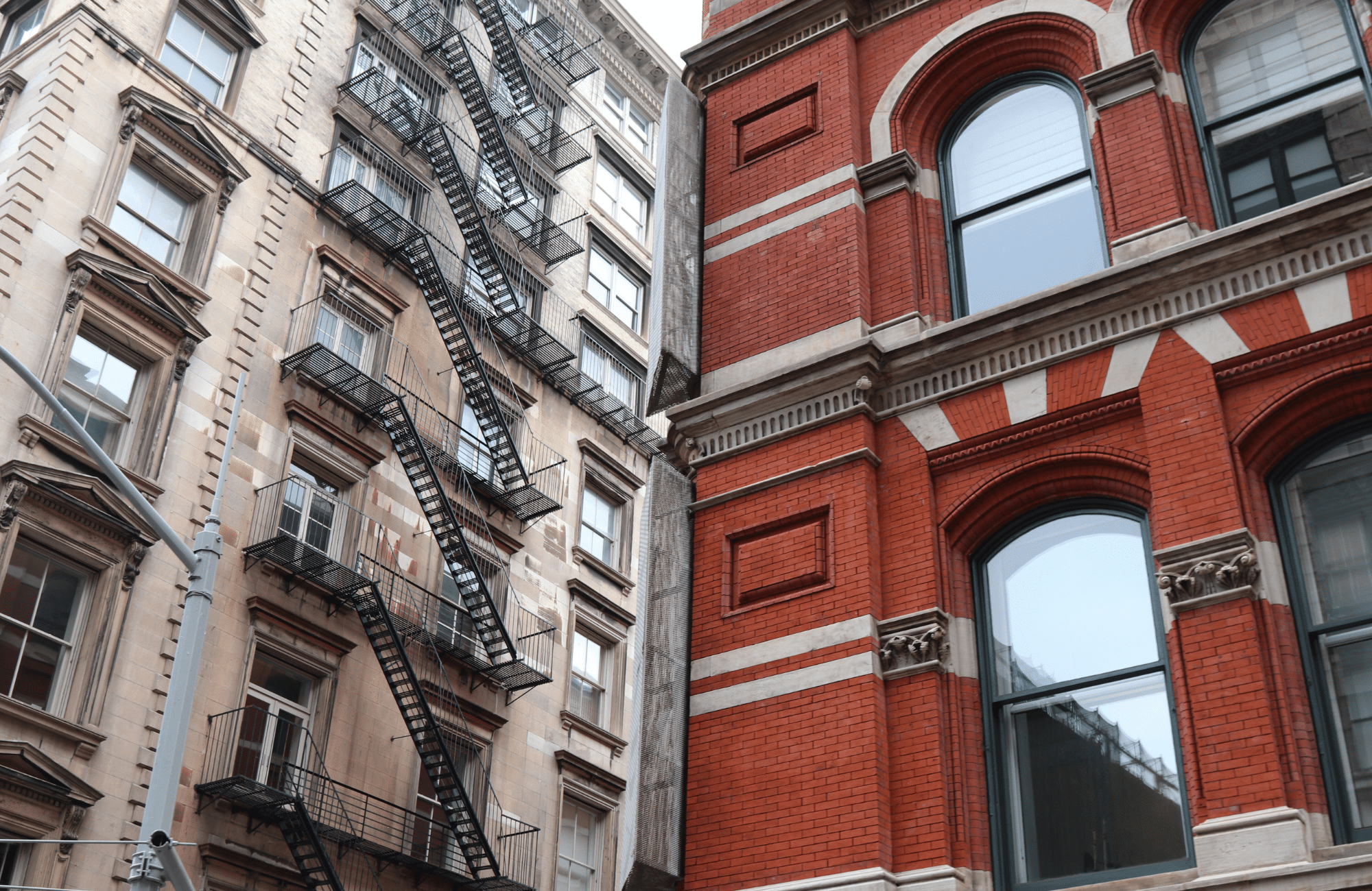 Two differently colored buildings in New York City.