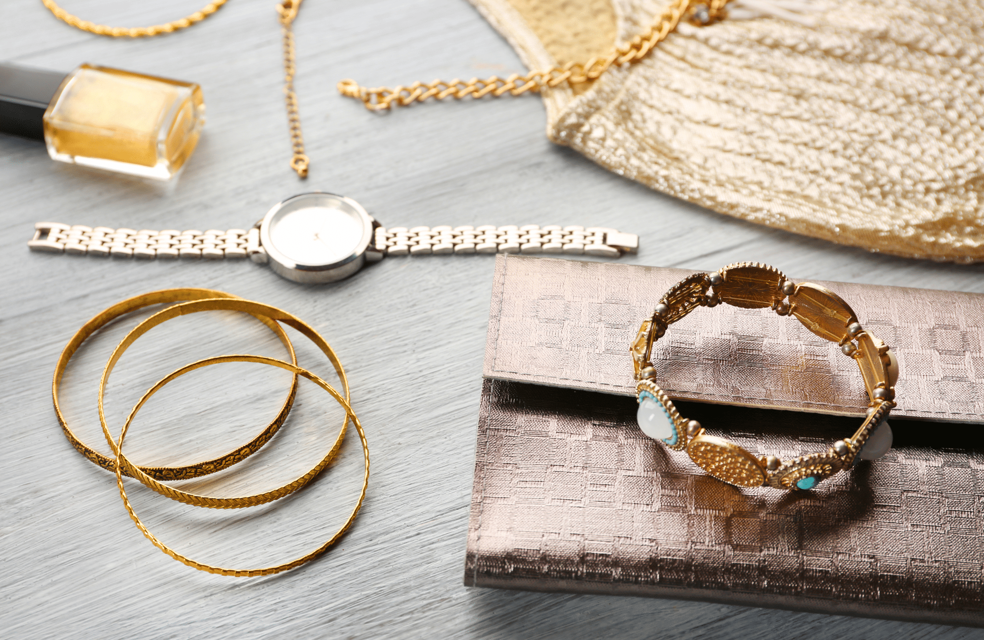 Overhead photo of various gold jewelry.