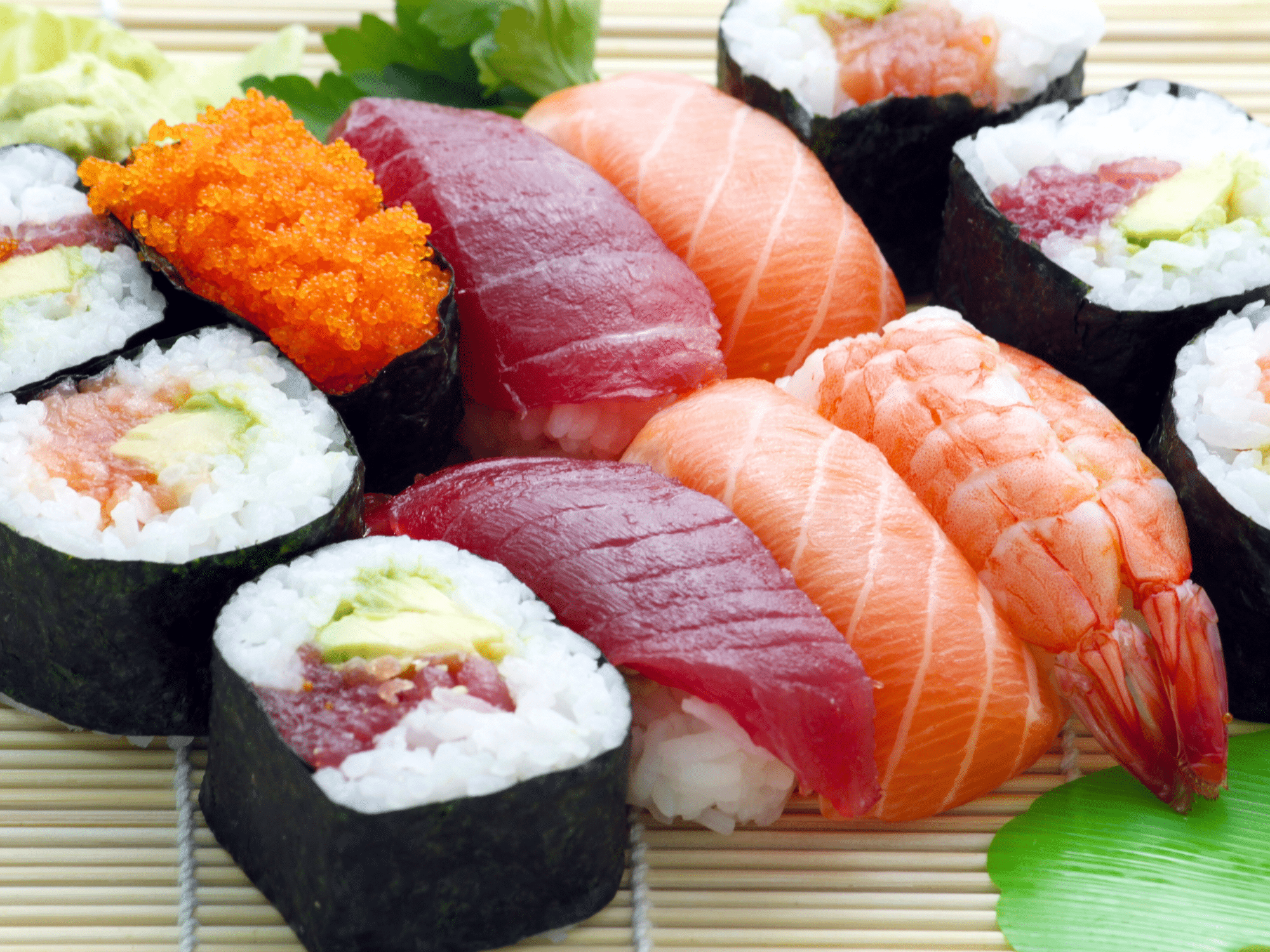Sushi rolls on a straw mat.