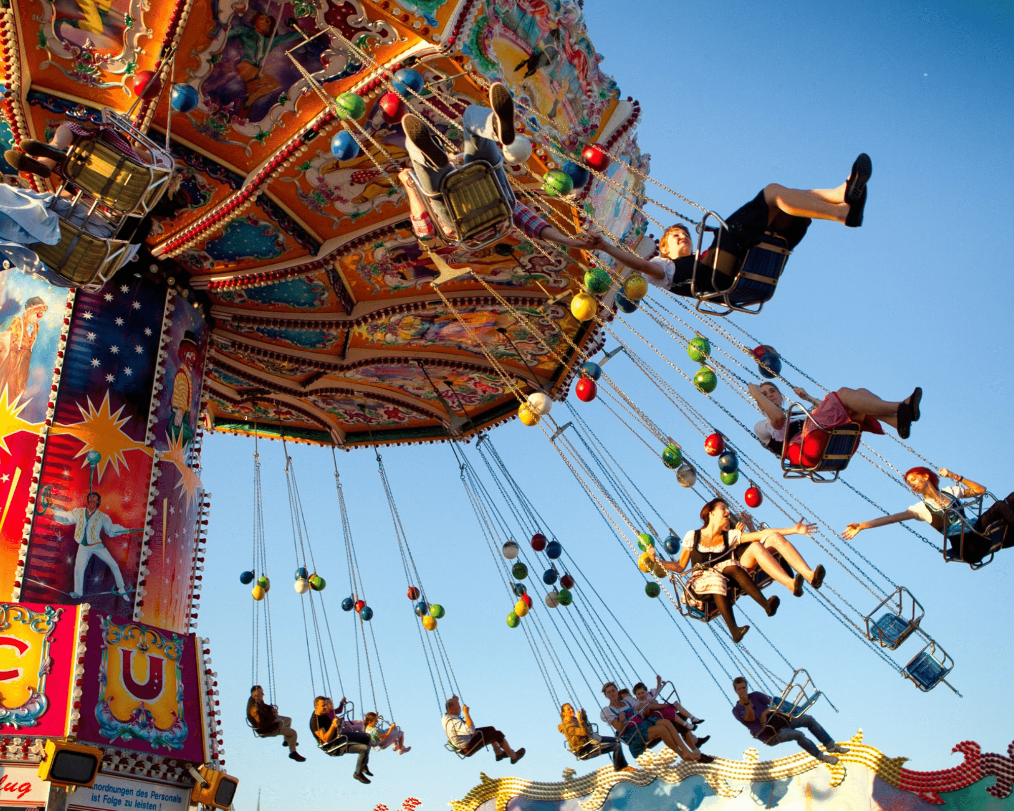 People on carnival swings.